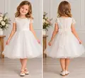 Ilette D0417 Girls Festive Dress, 6 Years, White, Hand-Embroidered Bodice, Voluminous Full Circle Tulle Skirt with Organza Bow, Short Sleeves