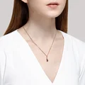 Подвеска-крестик Diamant 31-330-01631-1 для женщин, красное золото 375 пробы с родиевым покрытием, голубой топаз 0.814 ct, 6 круглых камней 3мм, 0.82г