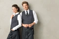 JOBELINE LUSINI Solutions GmbH Men's vest Bistro Herren Weste Bistro Men's vest Bistro; Size 46; graphite Herren Weste Bistro; Kleidergröße 46; graphit 65 % polyester, 35 % cotton. 60°C wash. Classic service waistcoat for men with adjustable back strap to adjust the width at the waist, 5-button placket, three piped outside pockets and one inside breast pocket. Comfortably cut and fully lined. Particularly hard-wearing and easy-care blended fabric. Back length: 66 cm for size 50. 65 % Polyester, 35 % Baumwolle. 60°-Wäsche. Klassische Serviceweste für den Herrn mit verstellbarem Rückenriegel zur Weitenregulierung in der Taille, mit 5-Knopfleiste, drei paspelierten Außentaschen und einer Brustinnentasche. Komfortabel geschnitten und komplett gefüttert. Besonders strapazierfähiges und pflegeleichtes Mischgewebe. Rückenlänge: 66 cm in Gr 50.