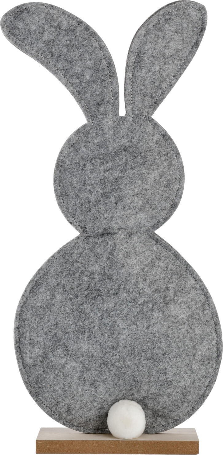 unknown LUSINI Solutions GmbH Easter bunny decoration Aldo Osterhasen-Aufsteller Aldo Easter bunny decoration Aldo; 18x4.8x39 cm (LxWxH); grey/brown Osterhasen-Aufsteller Aldo; 18x4.8x39 cm (LxBxH); grau/braun Easter bunny made of gray felt, with wooden base. Osterhase aus grauem Filz, mit Holzsockel.
