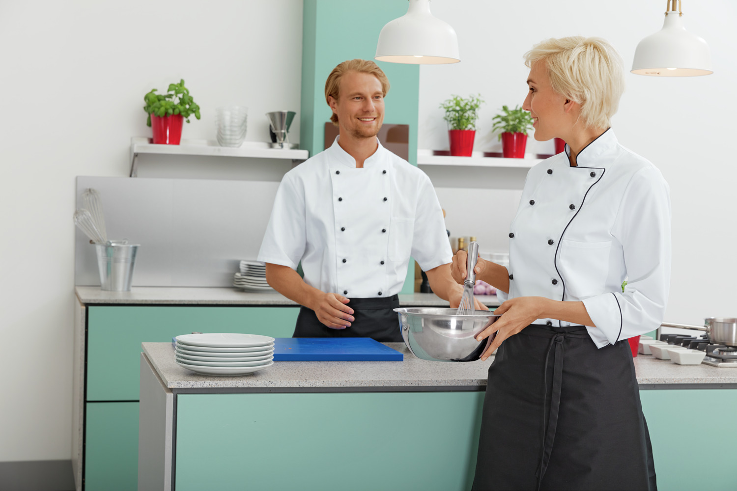 PULSIVA LUSINI Solutions GmbH Women's chef jacket Aila cotton half sleeve colored piping Damenkochjacke Aila Baumwolle Halbarm farbige Paspel Women's chef jacket Aila cotton half sleeve colored piping; Size 56; white/black Damenkochjacke Aila Baumwolle Halbarm farbige Paspel; Kleidergröße 56; weiß/schwarz 100 % cotton. 200 g/m². 60 °C wash. Modern, durable women's chef jacket made of easy-care cotton in half sleeves. With double row 6-button closure, double button placket and removable ball buttons. There is a contrasting colored piping at the collar and closure edge. This classic chef jacket features a patch chest pocket. Also available in long sleeve. Straight cut with maximum freedom of movement. Delivery incl. black ball buttons. Back length: 73 cm for size 36. 100 % Baumwolle. 200 g/m². 60°-Wäsche. Moderne, strapazierfähige Damenkochjacke aus pflegeleichter Baumwolle in Halbarm. Mit zweireihigem 6-Knopf Verschluss, doppelter Knopfleiste und abnehmbaren Kugelknöpfen. Am Kragen und an der Verschlusskante befindet sich ein farbiger Kontrastpaspel. Die klassische Kochjacke verfügt über eine aufgesetzte Brusttasche. Auch in Langarm erhältlich. Gerader Schnitt mit höchster Bewegungsfreiheit. Lieferung: inkl.schwarzer Kugelknöpfe. Rückenlänge: 73 cm in Gr 36