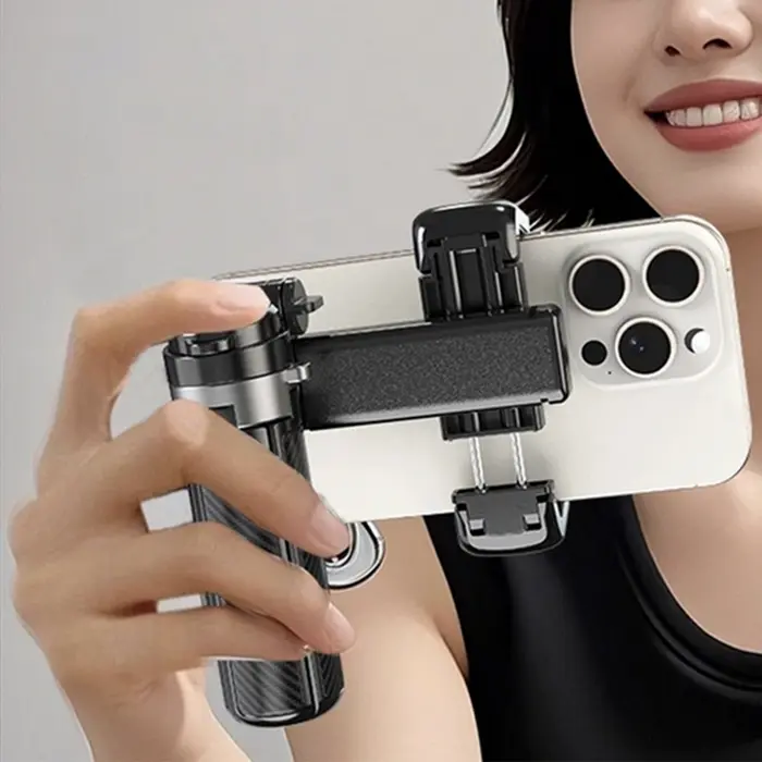 XO SS29 Portable Tripod and Selfie Stick, Pink, 64cm Extended Length, Aluminum and ABS, Bluetooth Remote, Carabiner Clip, Foldable Carbon Fiber Texture