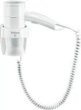 Valera Ligo Electric SA Hotel hairdryer Premium 1600 Hotelföhn Premium 1600 Hotel hairdryer Premium 1600; 24.5x18.3x11.5 cm (WxHxD); white Hotelföhn Premium 1600; 24.5x18.3x11.5 cm (BxHxT); weiß The Valera Premium 1600 Push is a compact and reliable hotel hairdryer with 1600 W power, perfect for guest rooms and guest bathrooms. The wall bracket is permanently connected to the power supply in the hotel room so that the hairdryer is securely installed and does not require an external power socket - ideal for professional hotel equipment. The hairdryer has an on/off push switch directly on the device and an on/off safety switch on the wall bracket, making it easy and intuitive for guests to operate. The flexible spiral cable ensures maximum freedom of movement without tangled cables. With two fan settings, three temperature settings and a cooling setting (Cool), drying can be customised, while robust workmanship and sophisticated design ensure long-lasting reliability. Features: * Powerful hotel hair dryer with 1600 W * On/off push switch on the appliance * On/off safety switch on permanently installed wall bracket * Wall bracket with electrical connection for safe installation * Spiral cable for flexible freedom of movement without cable clutter * 2 fan stages and 3 temperature stages for individually adjustable drying * Cooling stage (Cool) for a gentle finish * Robust workmanship for continuous professional hotel use Der Valera Premium 1600 Push ist ein kompakter und zuverlässiger Hotel?Haartrockner mit 1600?W Leistung, perfekt für Gästezimmer und Gästebäder. Die Wandhalterung wird fest an die Stromversorgung im Hotelzimmer angeschlossen, sodass der Haartrockner sicher installiert ist und keine externe Steckdose benötigt – ideal für professionelle Hotelausstattung. Der Föhn verfügt über einen Ein?/Aus?Druckschalter (Push?Schalter) direkt am Gerät sowie einen Ein?/Aus?Sicherheitsschalter an der Wandhalterung, was Gästen eine einfache und intuitive Bedienung ermöglicht. Das flexible Spiralkabel sorgt für maximale Bewegungsfreiheit ohne störenden Kabelsalat. Mit zwei Lüfterstufen, drei Temperaturstufen und Abkühlstufe (Cool) lässt sich das Trocknen individuell anpassen, während robuste Verarbeitung und durchdachtes Design für langanhaltende Zuverlässigkeit sorgen. Features: * Leistungsstarker Hotel?Haartrockner mit 1600?W * Ein?/Aus?Druckschalter (Push?Schalter) am Gerät * Ein?/Aus?Sicherheitsschalter an fest installierter Wandhalterung * Wandhalterung mit elektrischem Anschluss für sichere Montage * Spiralkabel für flexible Bewegungsfreiheit ohne Kabelsalat * 2 Lüfterstufen und 3 Temperaturstufen für individuell einstellbares Trocknen * Abkühlstufe (Cool) für sanftes Finish * Robuste Verarbeitung für den professionellen Hotel?Dauereinsatz